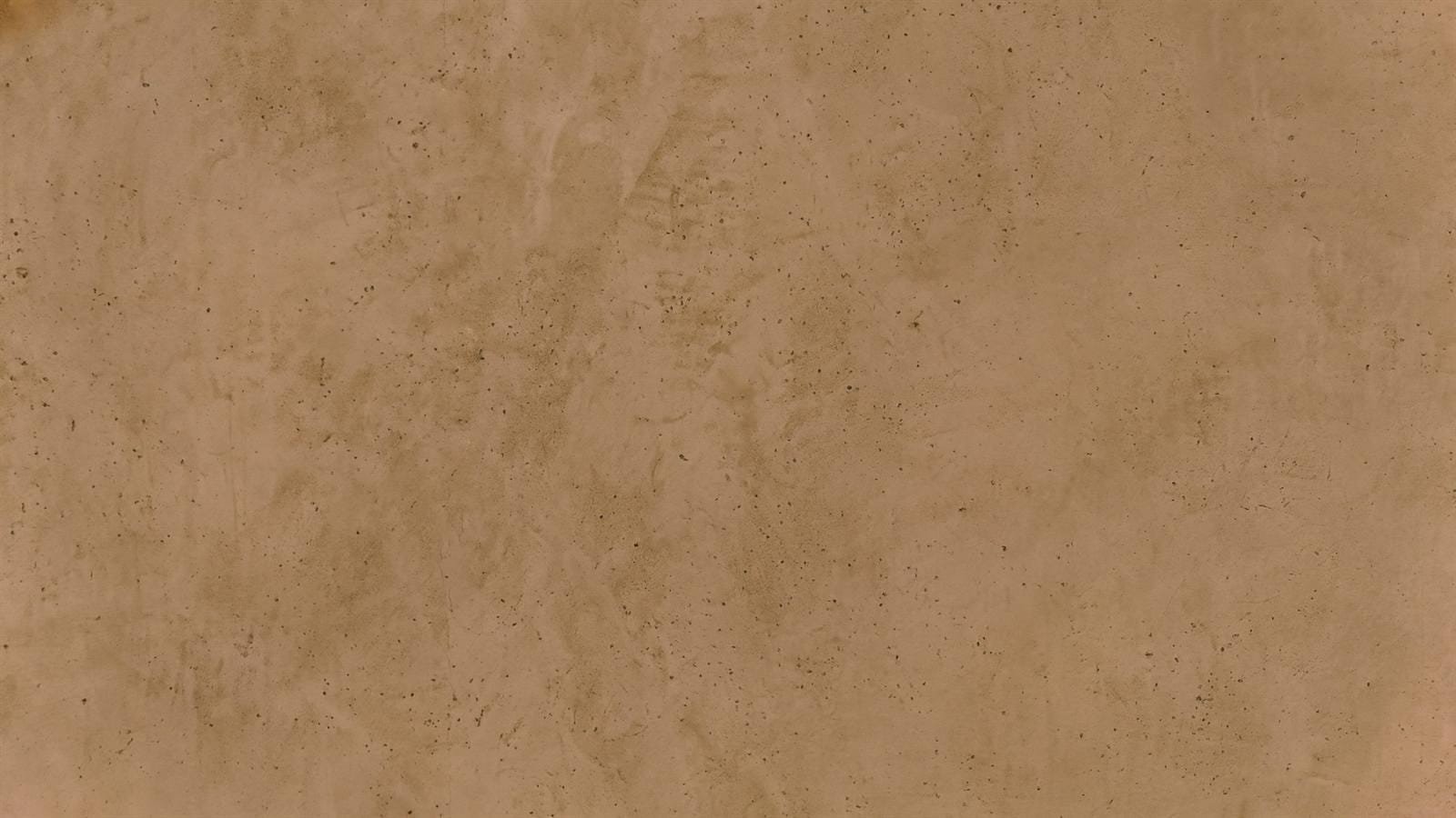 Hand-applied Microtadelakt texture up close at the Calligraphy Museum, Madinah, trowel movement held in the finish